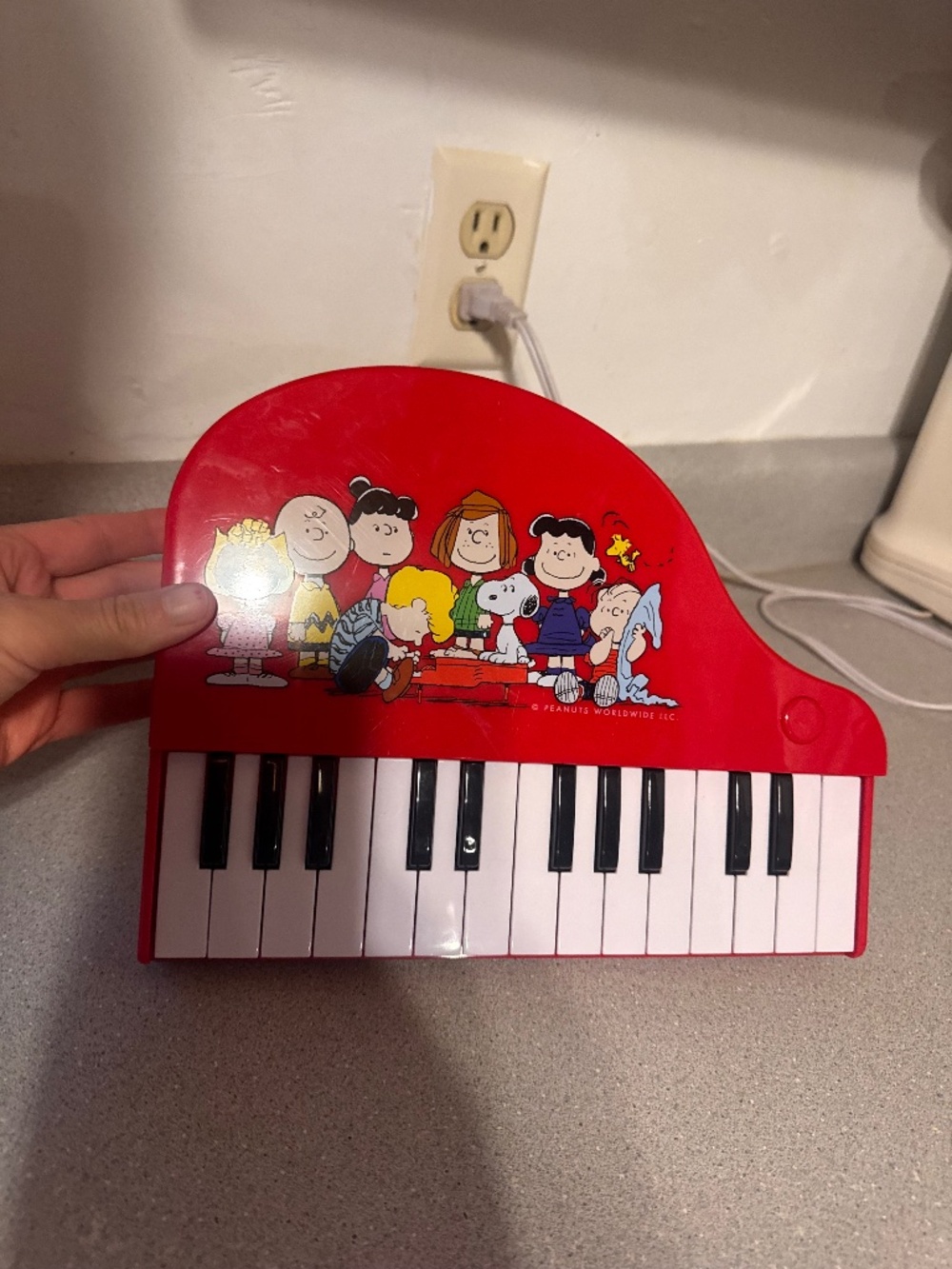 Peanuts Schroeder's Piano Musical Instrument Toy features a colorful graphic of